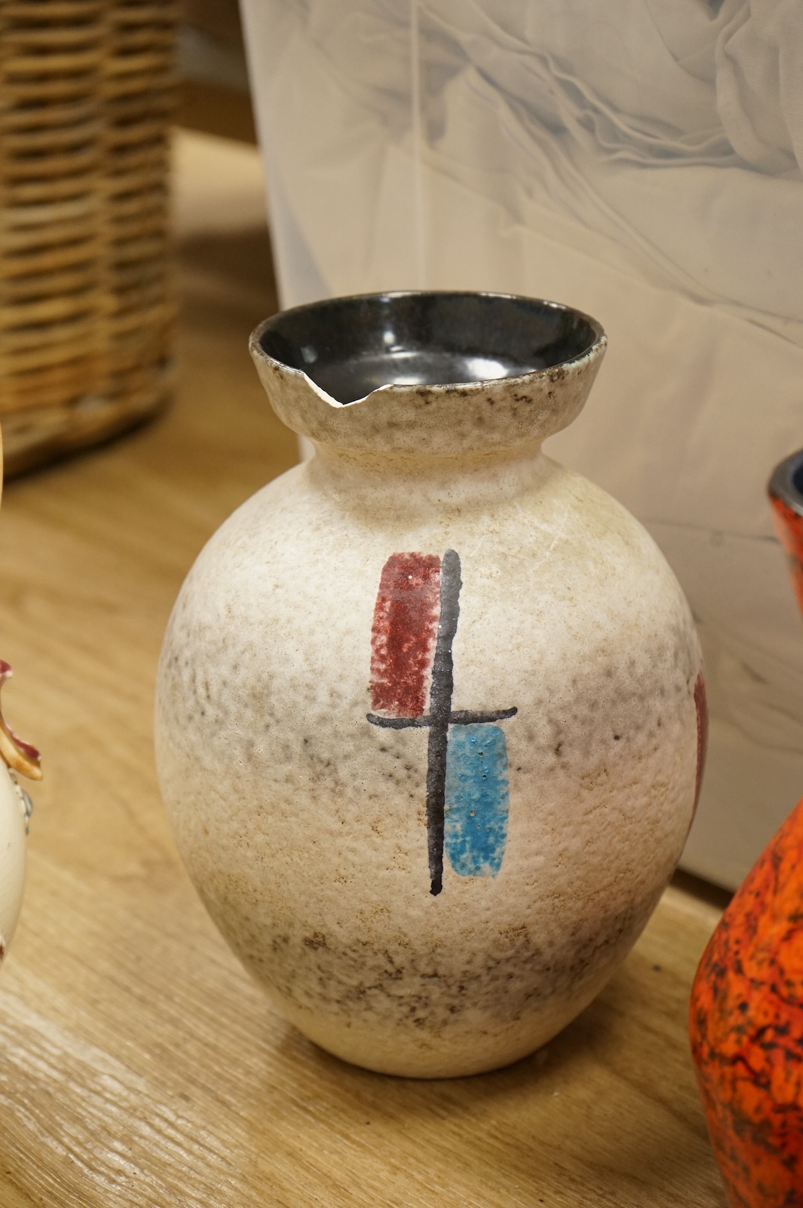 A collection of studio ceramics and pottery to include a Zsolnay vase and a Lyn Alves hexagonal dish